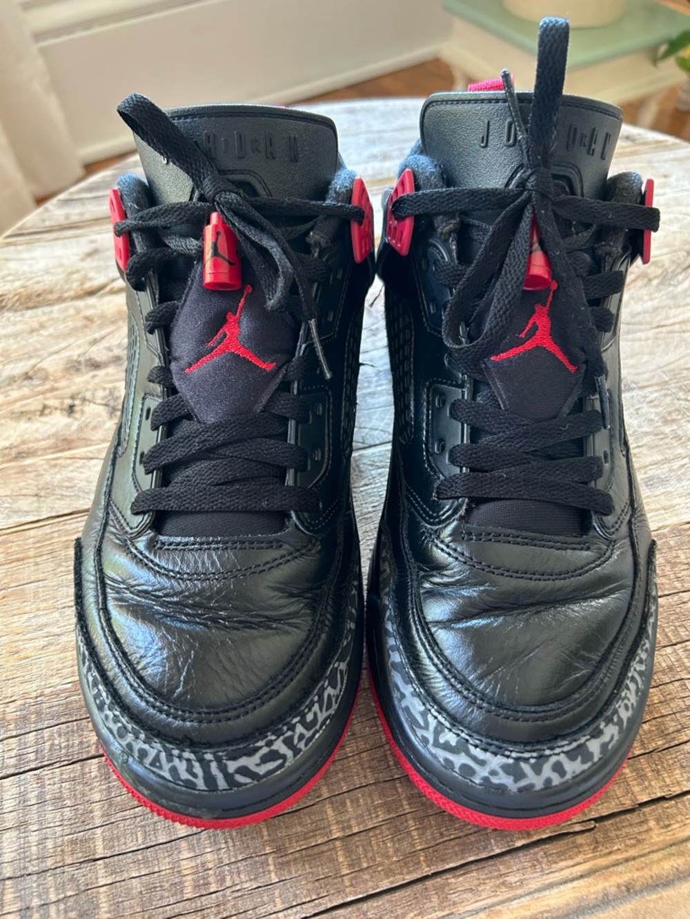 Nike Black and Red Jordan Sneakers with Elephant-Print Accents